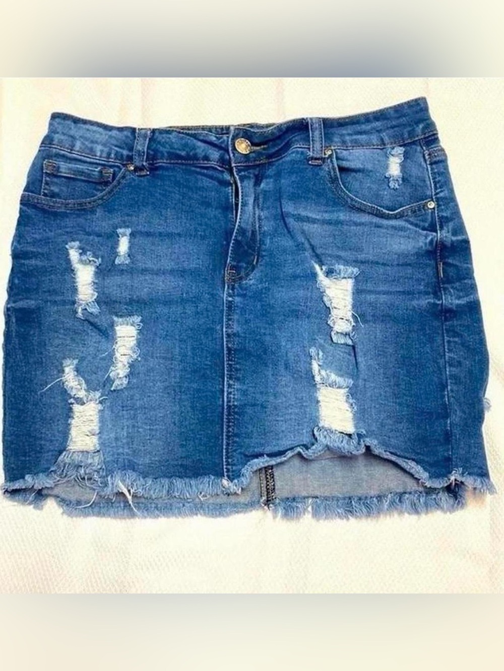 Wax Jean distressed mini skirt